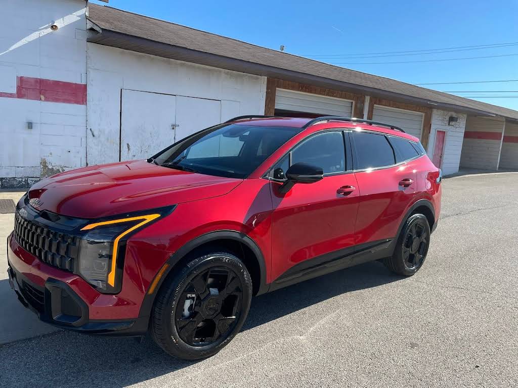 Deep red SUV with a mirror-gloss finish after paint correction and coating